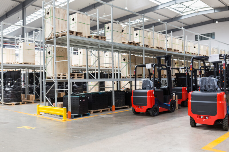 Large hangar warehouse of industrial and logistics companies. Long shelves with a variety of boxes. industry space and hardware box for delivery, business logistic distribution, storage cargo concept.
