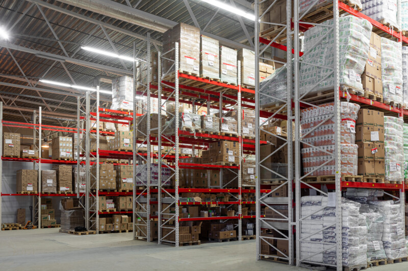 warehouse center with high racks designed to store goods before sending them to the store.
